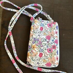 Floral wristlet or over the shoulder handbag.